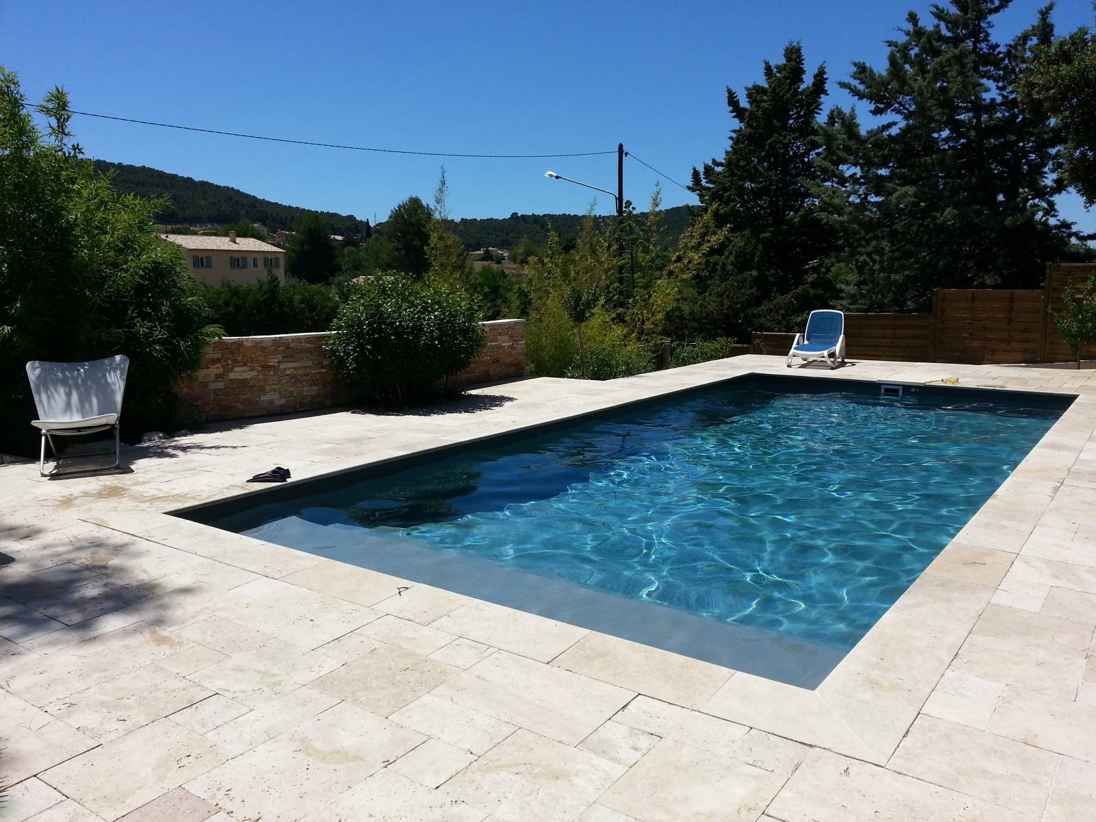 plage travertin autour piscine 9x4